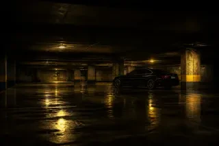 Scene background — the dark parking garage