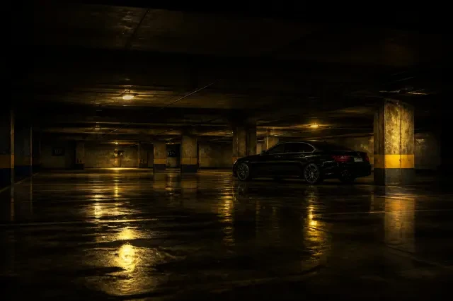 Scene background — the dark parking garage